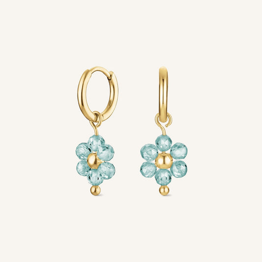 Boucle d'oreille fleur bleue